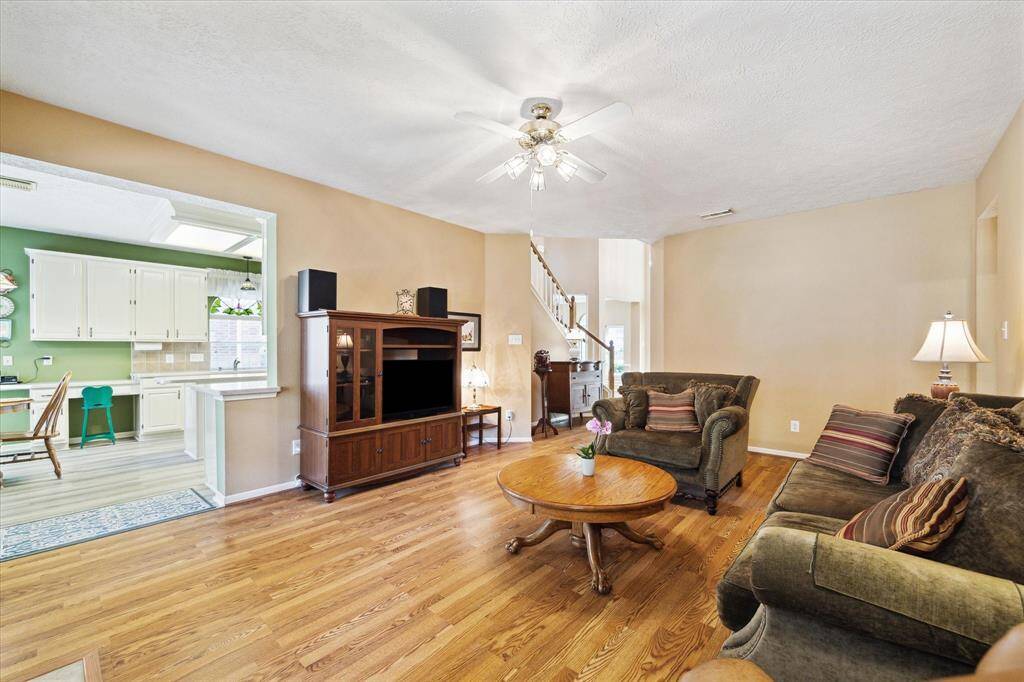 The den offers a perfect blend of spaciousness and warmth.