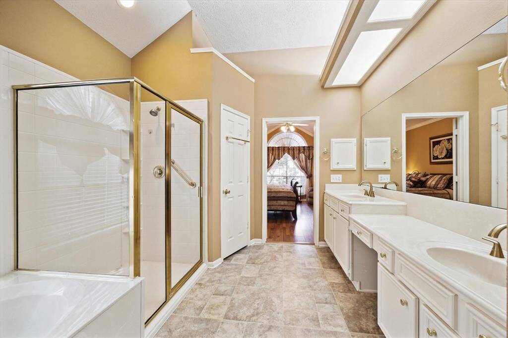 Luxurious primary bathroom with ample space and elegant design.