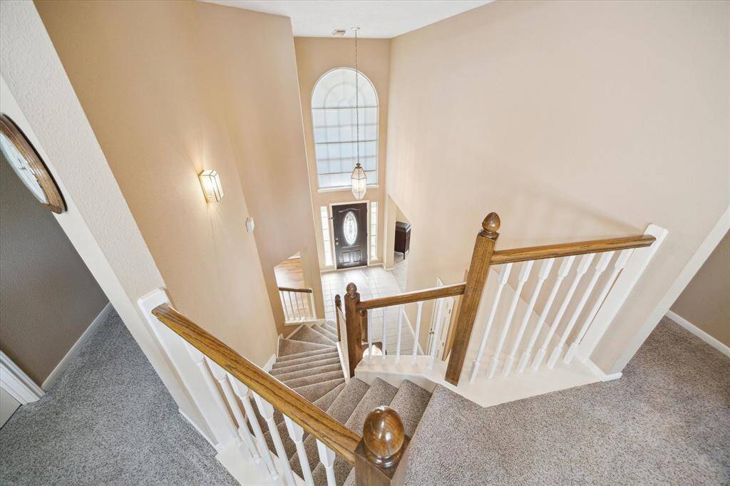 Admire the elegant foyer from the upstairs landing.