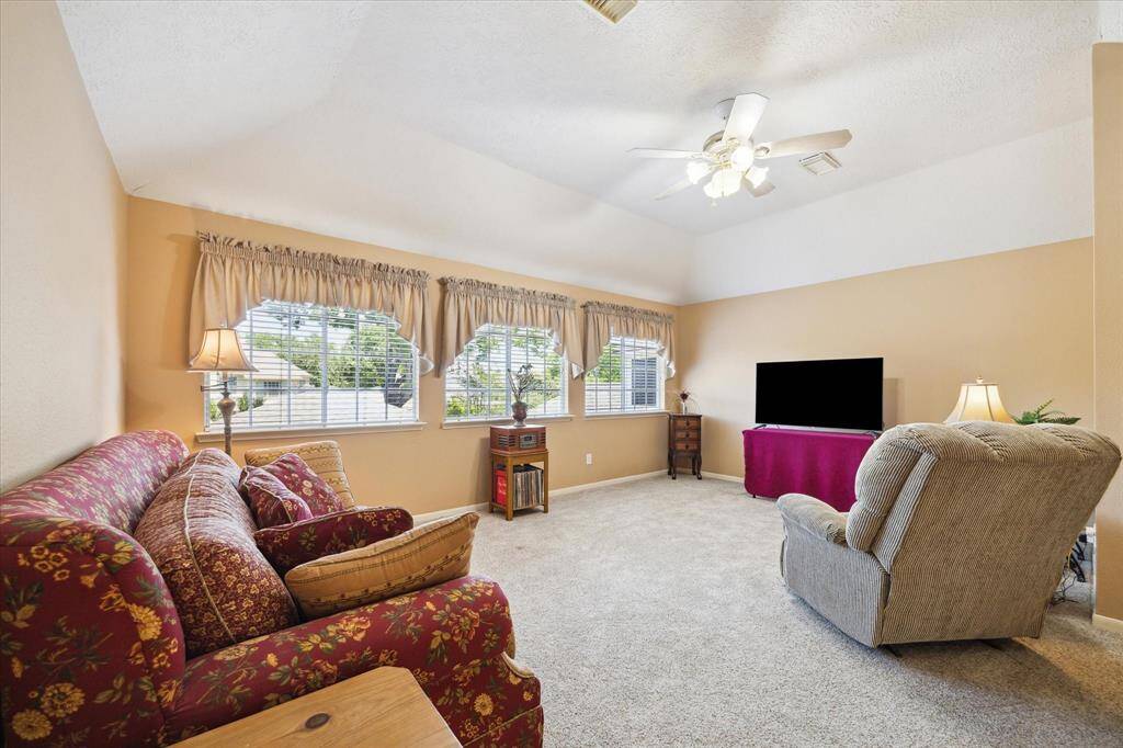 This versatile space is perfect for a cozy second living room, a lively game room, or a convenient workout area and offers great views of the backyard.