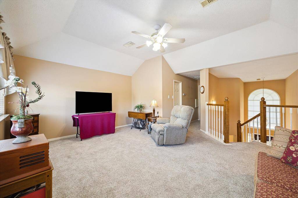 This inviting space on the second floor offers easy access to all secondary bedrooms, perfect for a cozy family area or media room.