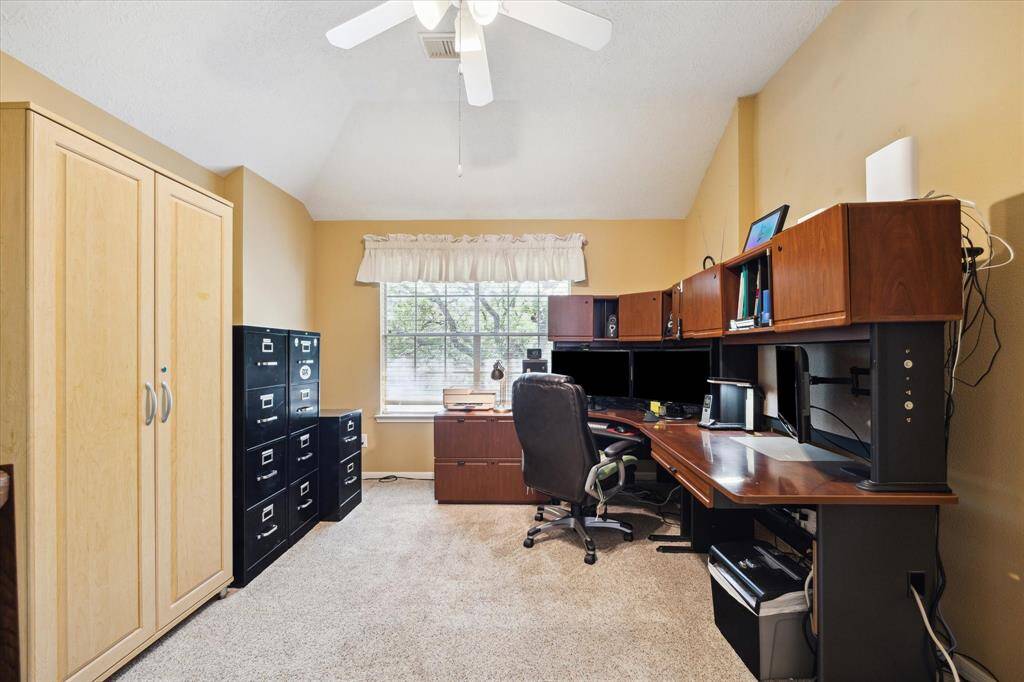 This versatile secondary bedroom, currently set up as a home office, offers endless possibilities to suit your needs.
