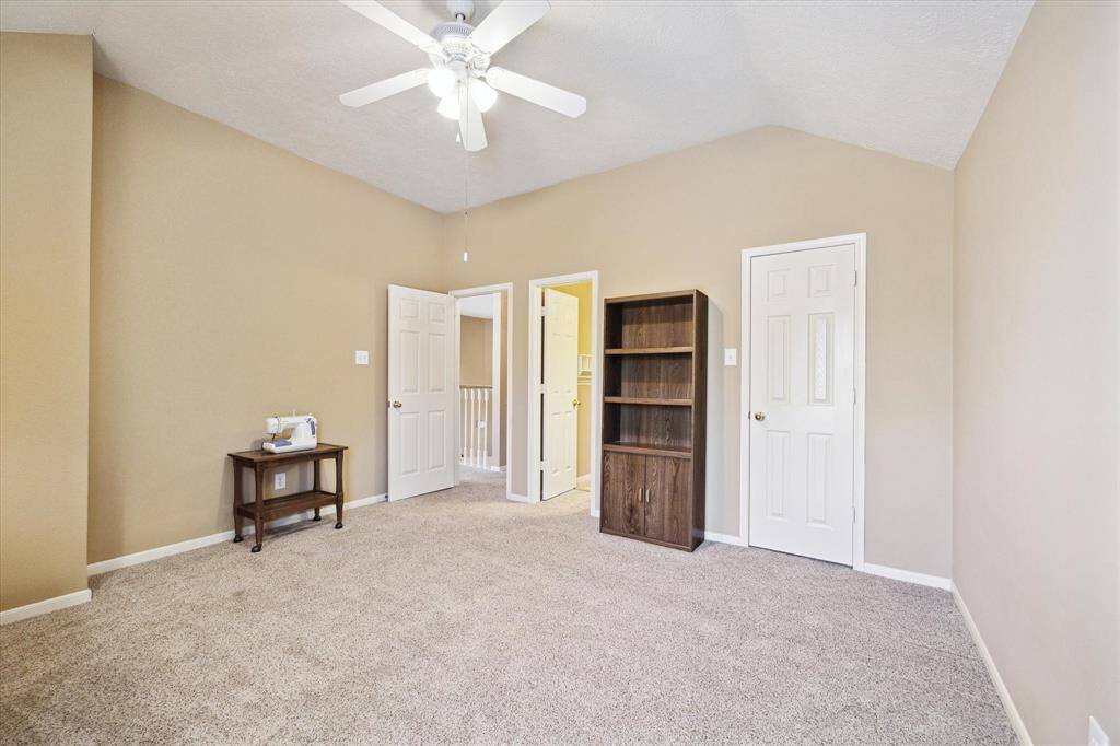 Cozy second-floor bedroom with ample natural light.