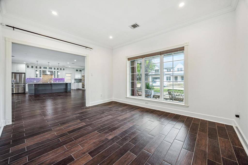 SUN-FILLED ROOM OFF OF LIVING AREA IS PERFECT FOR A  FORMAL LIVING ROOM OR FORMAL DINING ROOM!