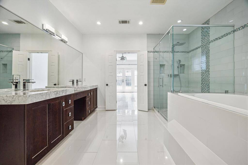 DOUBLE SINK VANITY ALLOWS FOR PLENTY OF SPACE IN THIS SHOWSTOPPING MASTER BATH!