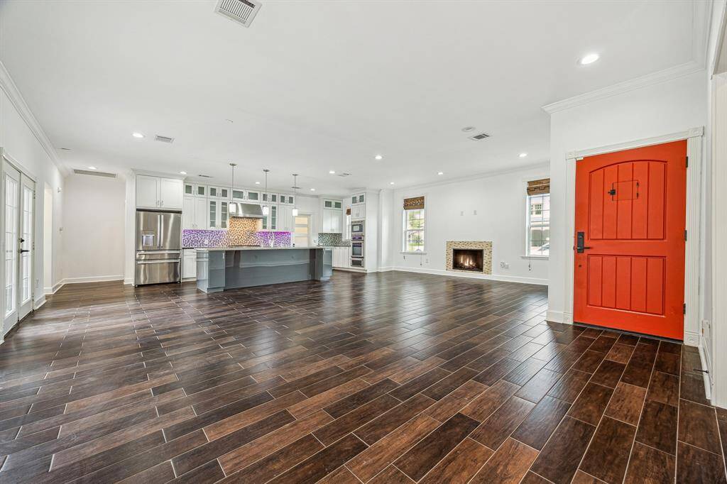 FRONT DOOR ENTRY OPENS TO AN OPEN-CONCEPT LIVING AREA & CHEF'S HAVEN KITCHEN!