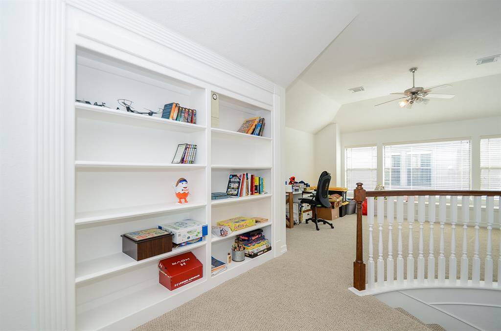 As you leave the gameroom heading towards the bedrooms you'll pass this fantastic built in bookcase to house not only books but games, videos, CDs, puzzles or decor.