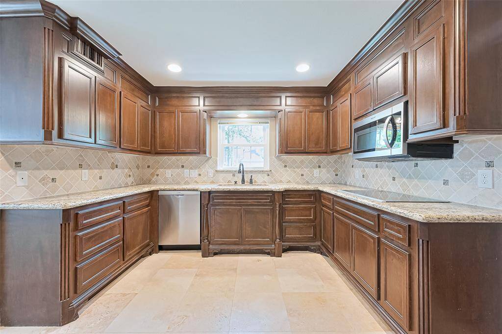 Efficient and stylish functional kitchen with ample cabinetry and modern appliances.