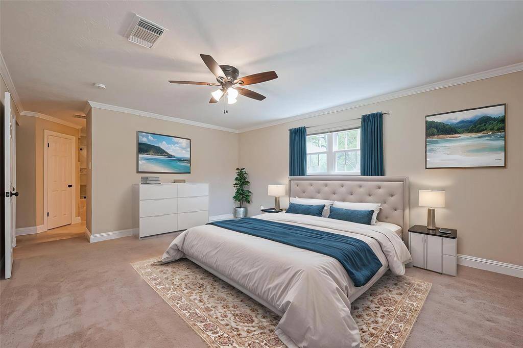 Spacious and serene primary bedroom located upstairs for added privacy.