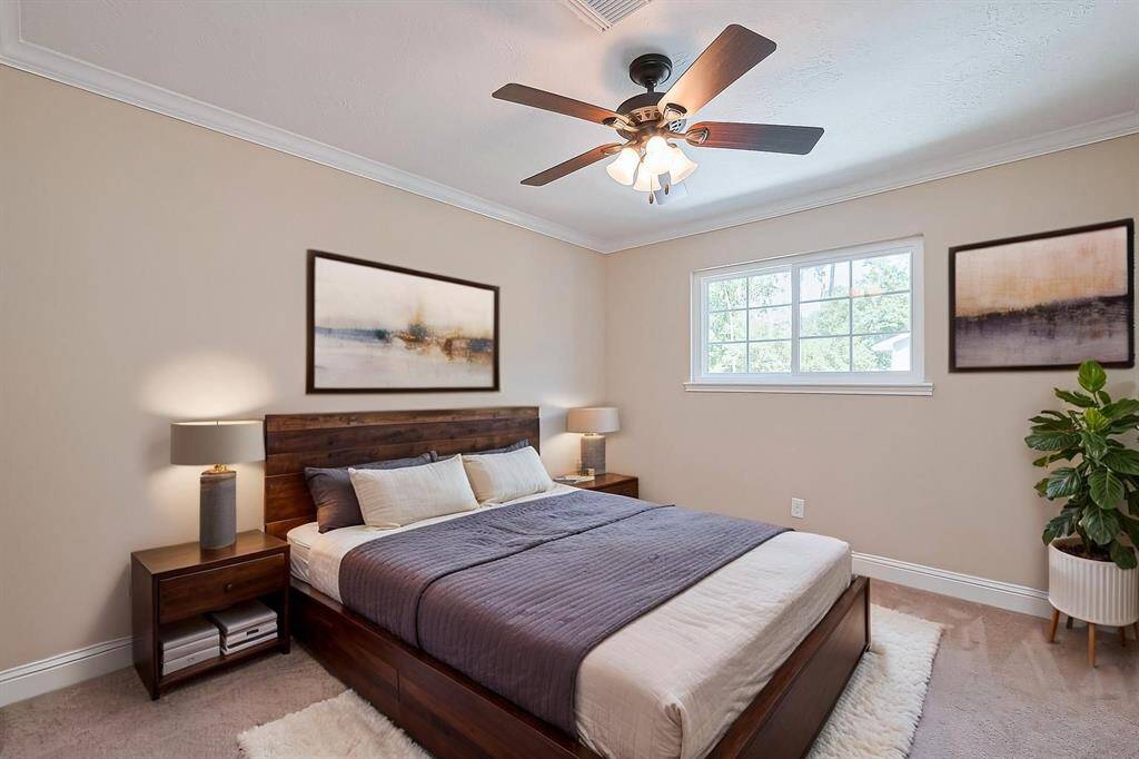 Virtually staged. Cozy and inviting third bedroom with abundant natural light and modern finishes with walk-in closet.