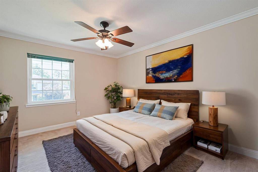 Secondary bedroom #4 offers a cozy and inviting bedroom with ample natural light, perfect for relaxation or guests with walk-in closet.