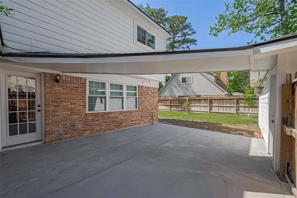 Enjoy seamless access with a convenient covered walkway connecting the house to the garage.