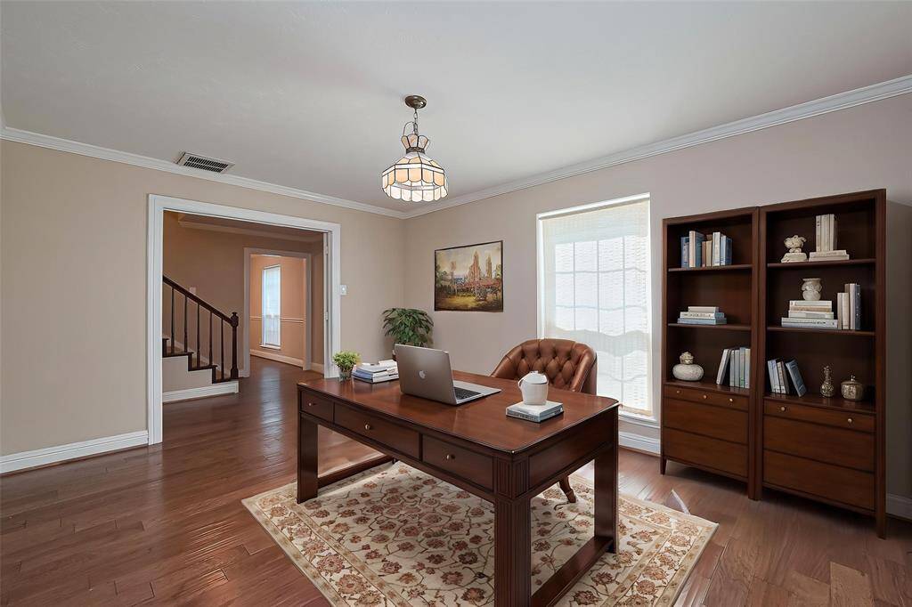 Virtually Staged. This bright and inviting study features engineered wood floors, an abundant natural light—ideal for focused work or relaxation.