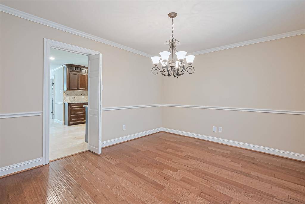 Formal Dining. Notice the chair rail and crown molding.