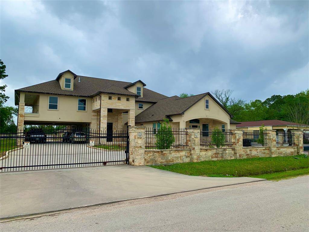 Welcome to your dream home. View of entire facade. Notice the wide driveway and two separate entrances.