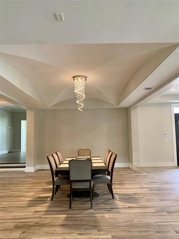 Notice the detail in the 12 foot ceiling and dining space.