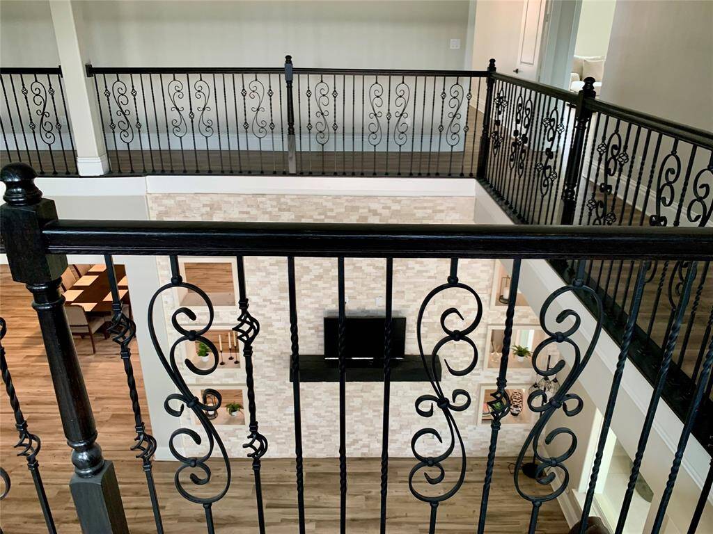 View into the den from upstairs - open hallway/balcony