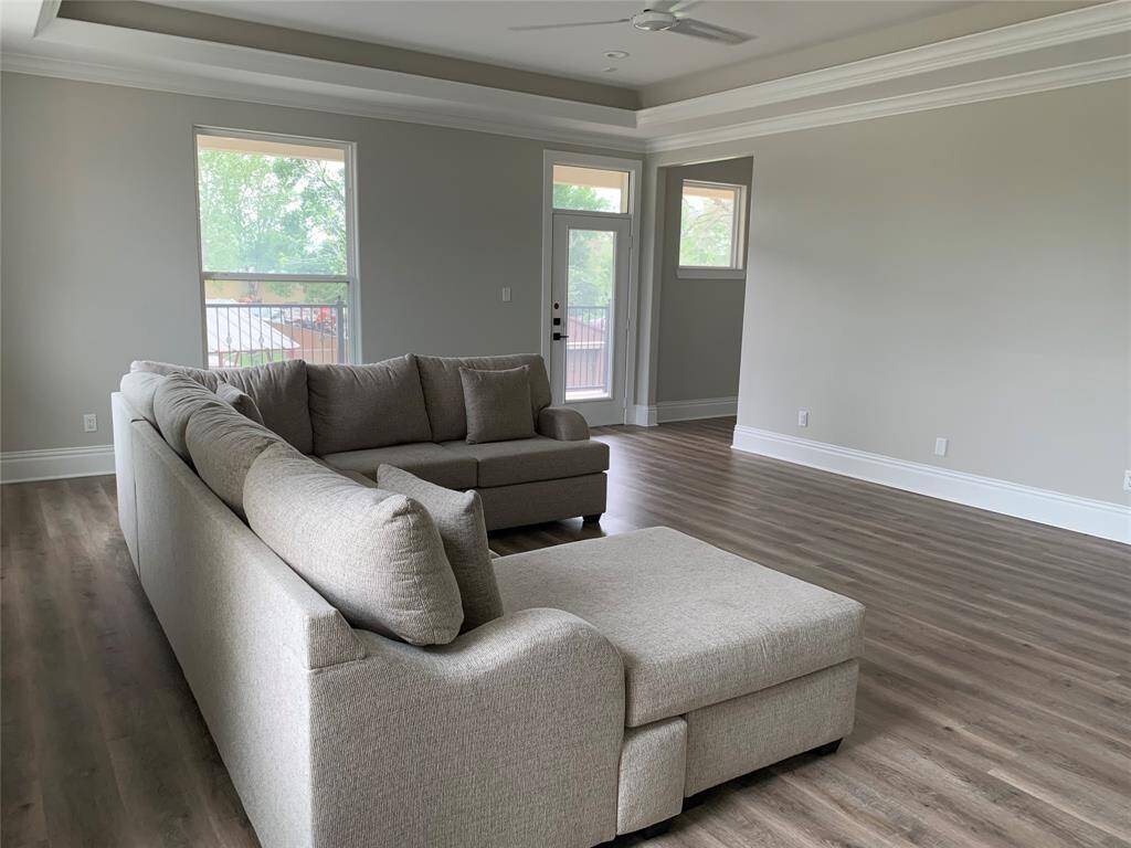 Game Room is currently being used as a lounge area. Around the corner is a nook with a desk and space for a small fridge and for placing a popcorn machine to enjoy family fun movie nights.