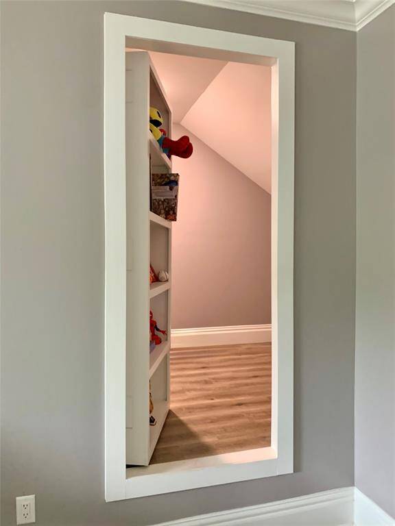 A surprise in the boys room. Just push in the built-in book shelf and you will find a secret little hidden playroom.