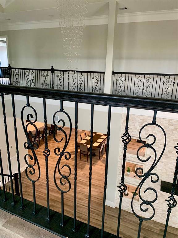View from upstairs of the dining room and kitchen island.