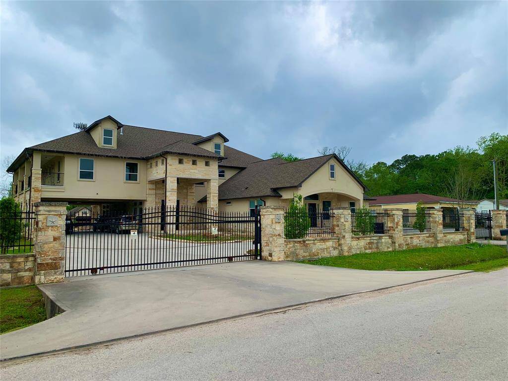 View of the two driveway entrances and the expanse of the home's facade.
