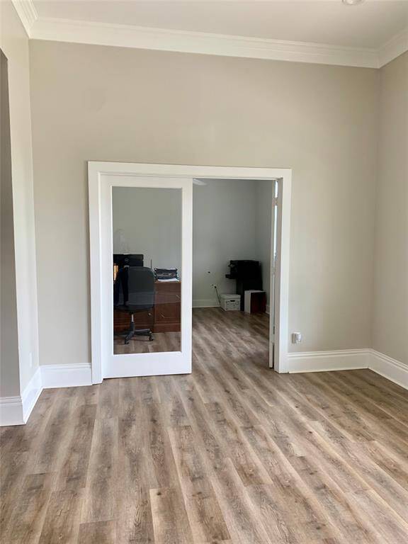 To the right of the kitchen is a large open floor with so many possibilities. This is one of two office spaces in this area. This could be an entire home office suite. The other two bedrooms on either side could be used as offices etc.