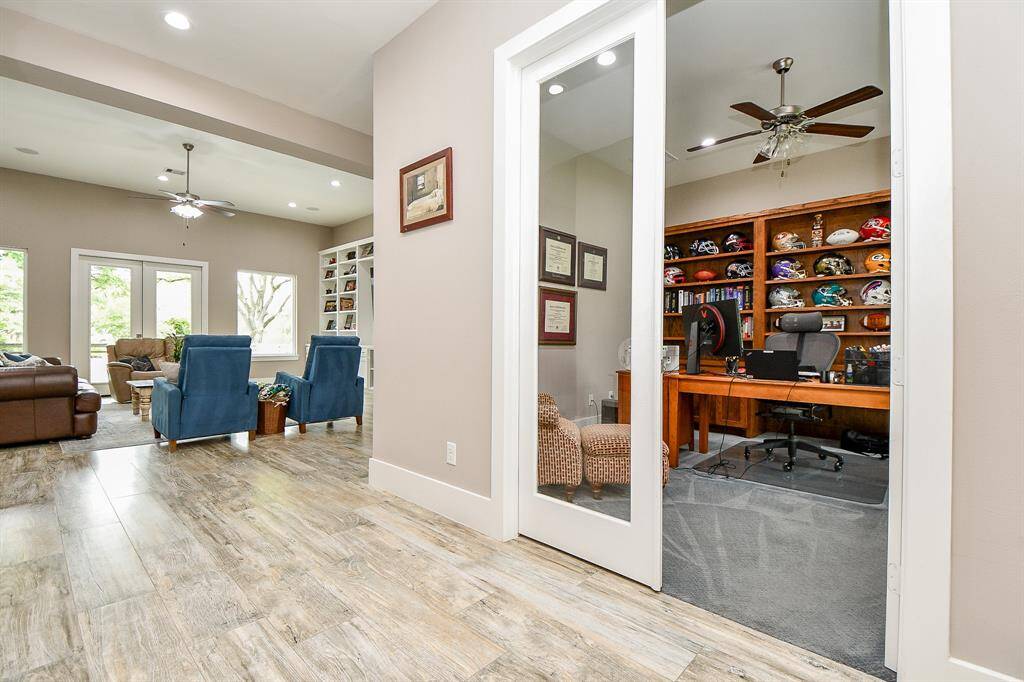 As you enter into the foyer of the home, the glass french doors will lead you to the study/home office.