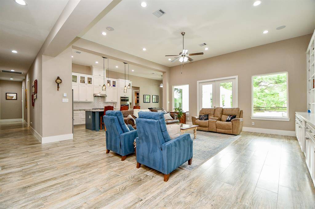Spacious, open-concept living area. Dual surround sound speaker system in the family room and outdoor patio.