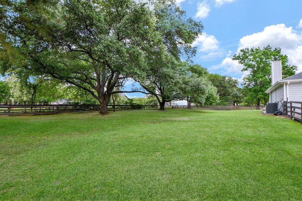 Enjoy the shade from the trees while you play catch, soccer, croquet or add a swing set.