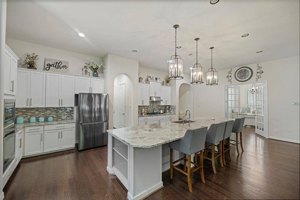 This kitchen is ready for any gathering cooking and other wise.  There is room for everyone.