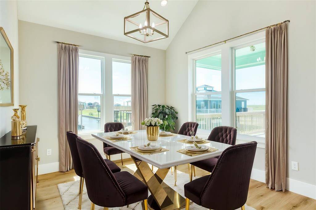 Bright dining room with stunning deck views.