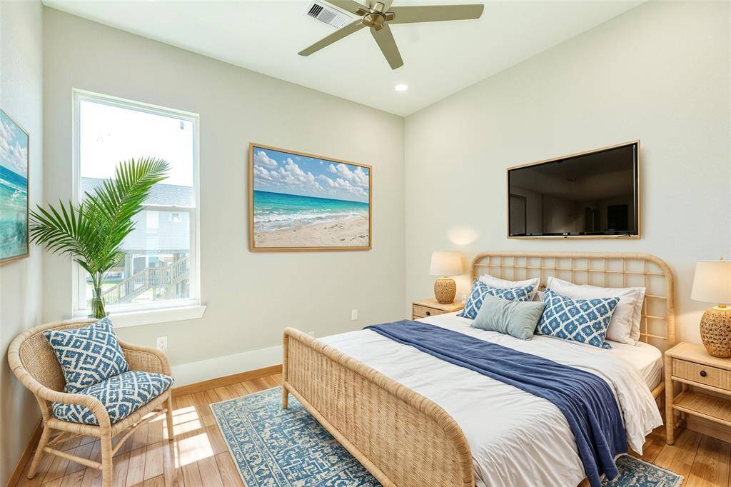 Experience comfort and style in this beautifully staged bedroom, featuring modern decor and ample natural light.