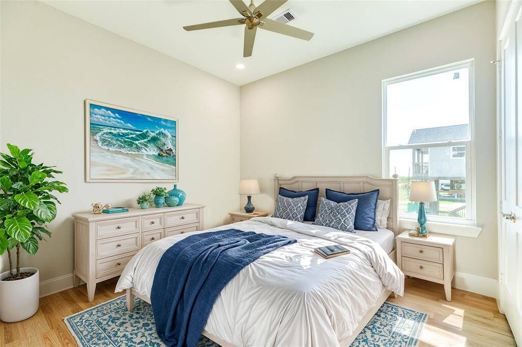 Inviting second bedroom with virtual staging showcases a cozy and stylish retreat in bedroom 2.