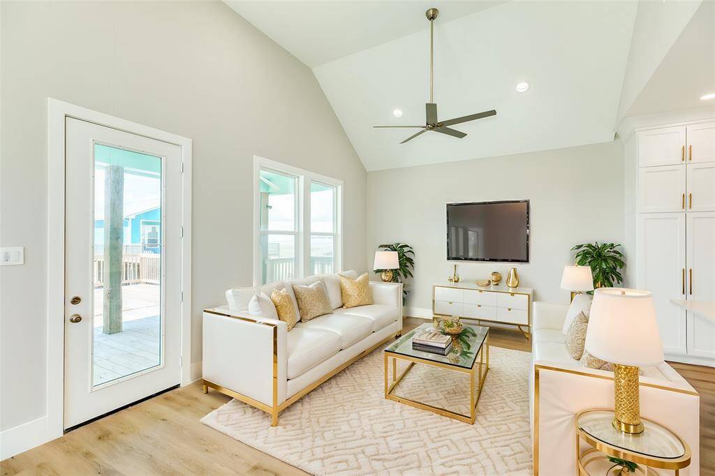 Experience the perfect open-concept living space, ideal for relaxation and gatherings at 591 Pompano.