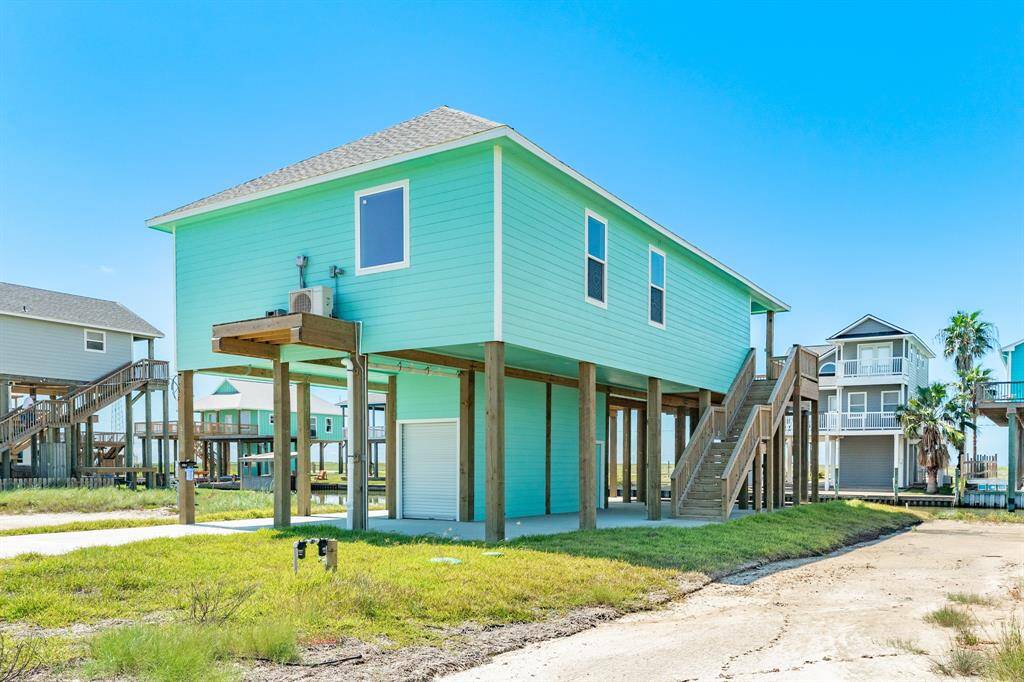 Inviting coastal-style home with elevated design, offering stunning views and outdoor entertainment space.