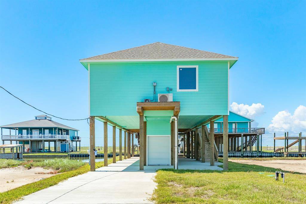 Discover coastal living at 591 Pompano, Freeport, TX. This vibrant, elevated home offers stunning views and easy access to the water. Perfect for relaxation or entertaining.