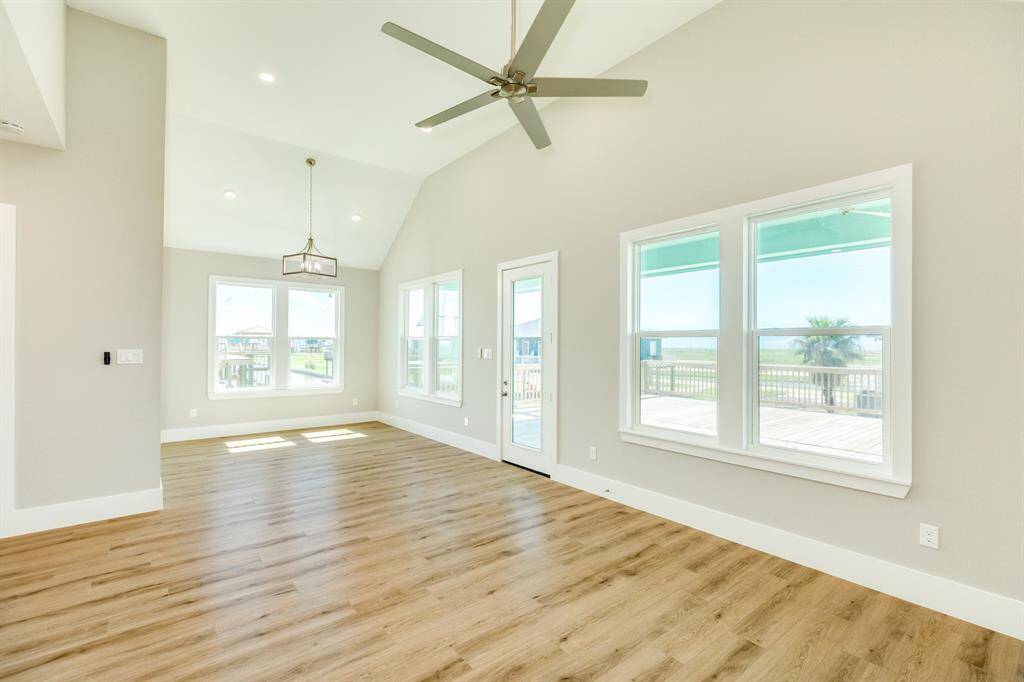 Bright and airy living space with high ceilings and abundant natural light, perfect for relaxation and entertainment.