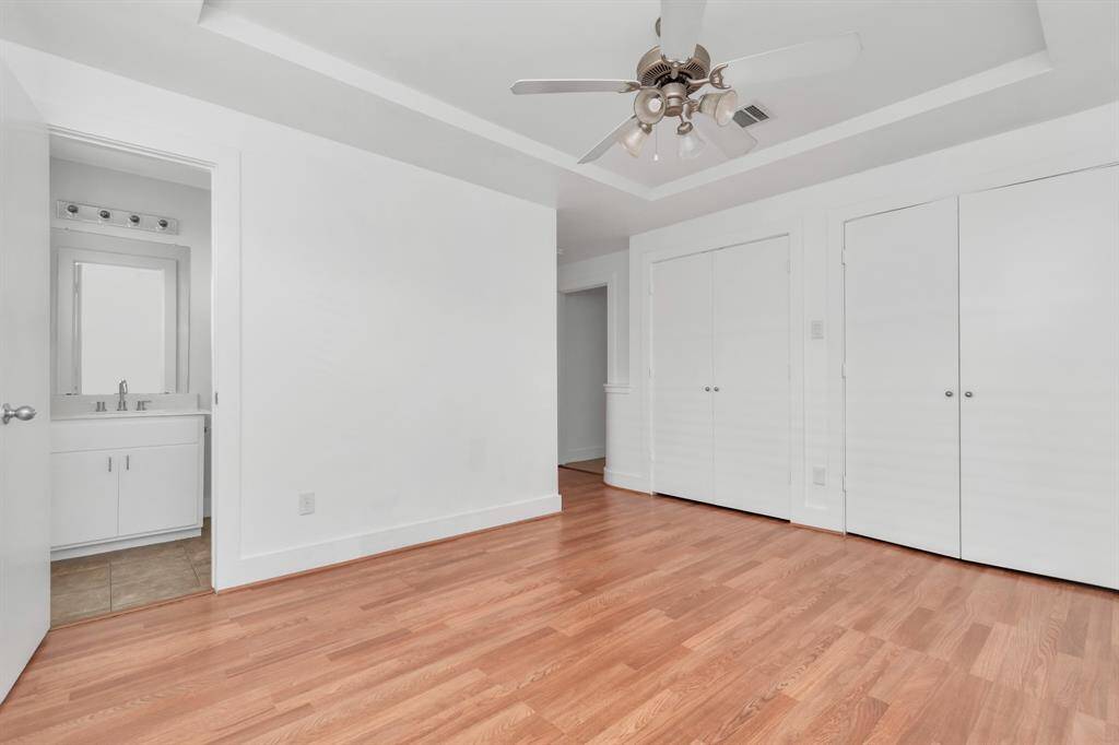 Primary bedroom with large closet space, and full bathroom.