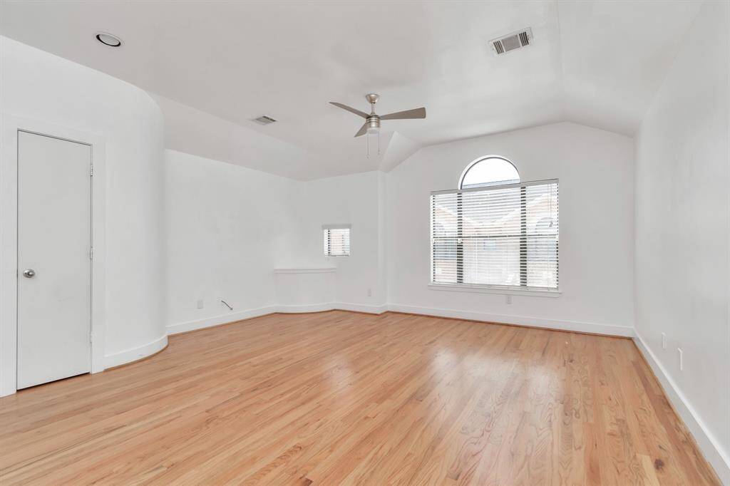 Living room area, open floor plan leading to the kitchen.