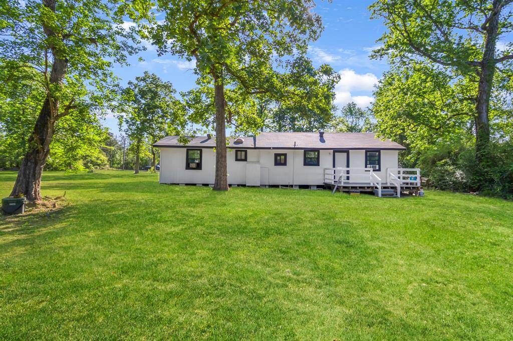 Back of the home with porch.