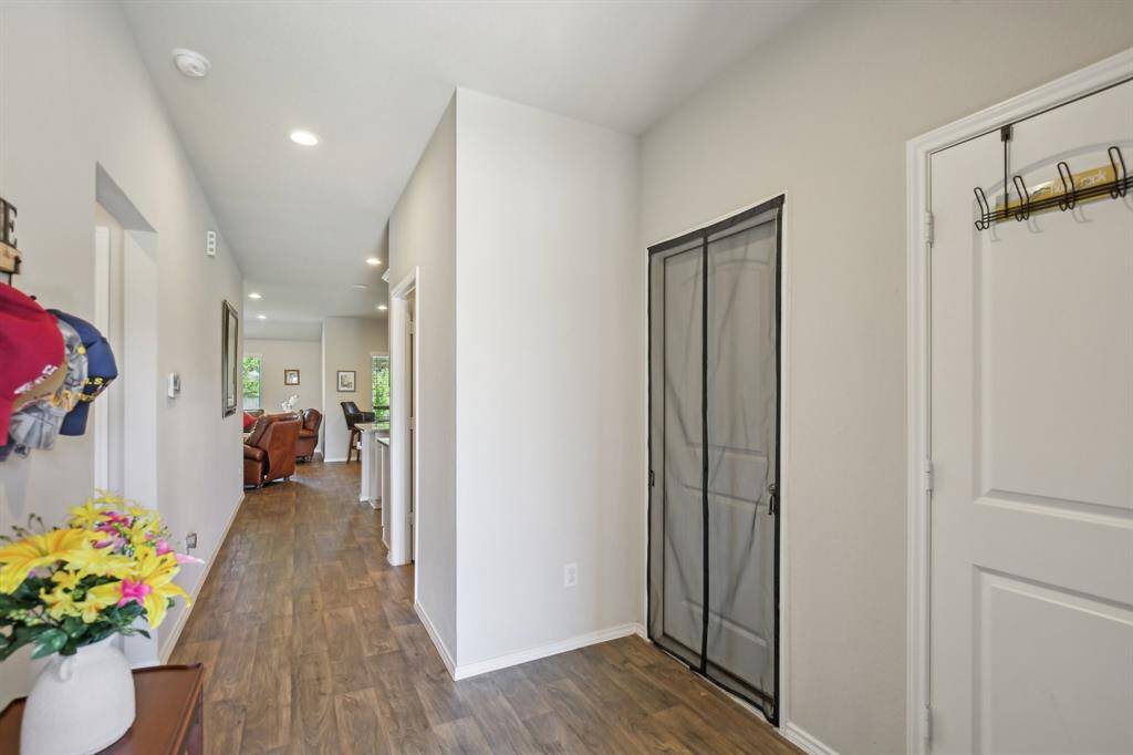 View as you enter the front door. There is a hall closet on the right and then the door to the garage.