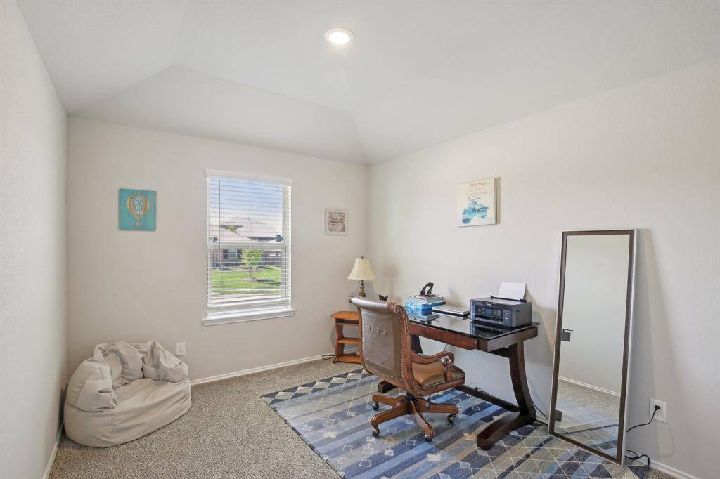 Bedroom with window overlooking the front yard.
