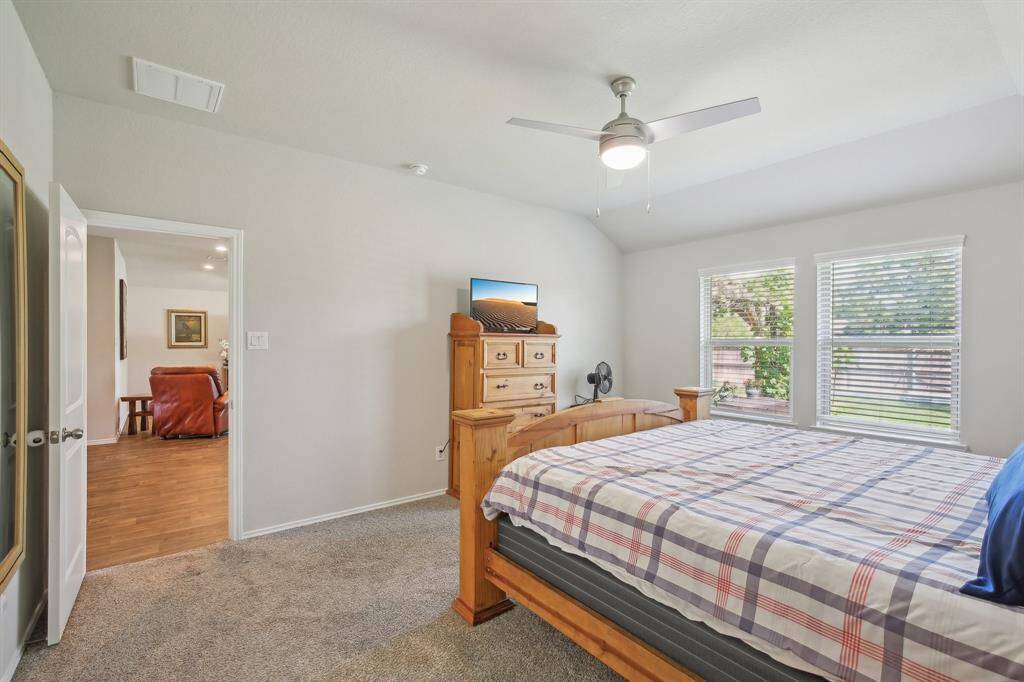 The large primary bedroom is just off the dining area and away from the other 2 bedrooms for privacy.
