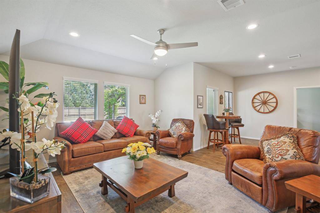 Living room over looks the back yard and flows into the kitchen and dining areas.