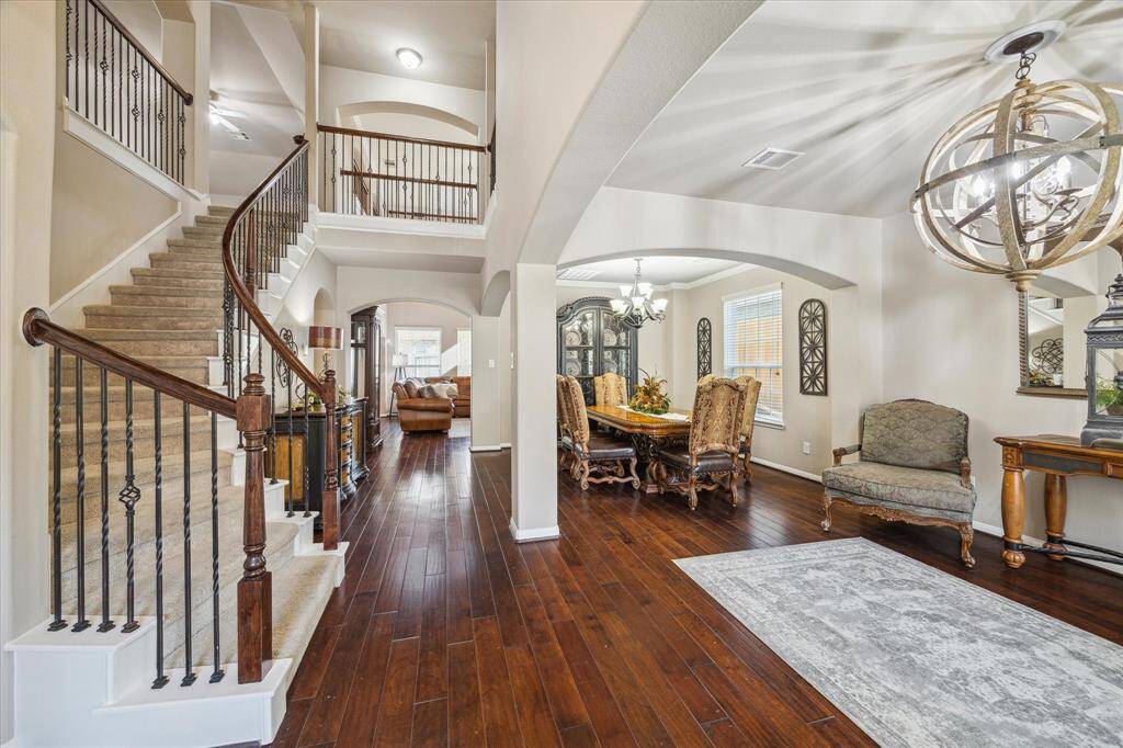 Beautiful two story entry with high ceilings with open concept formal living & dining room on your right.