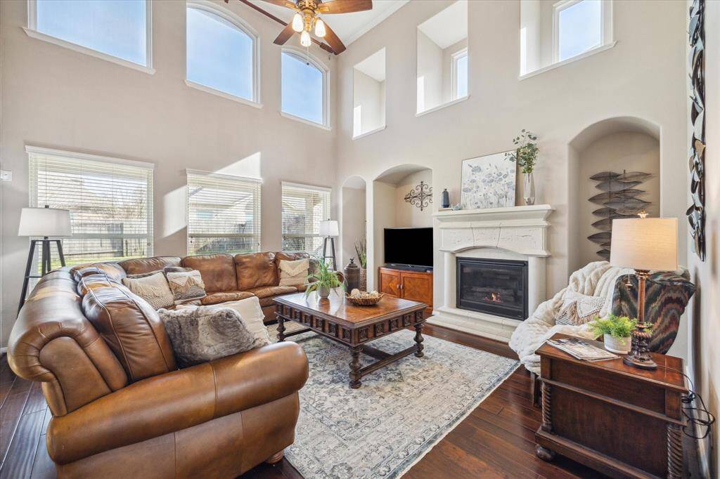 Family Room with lots of natural light anchored by fireplace