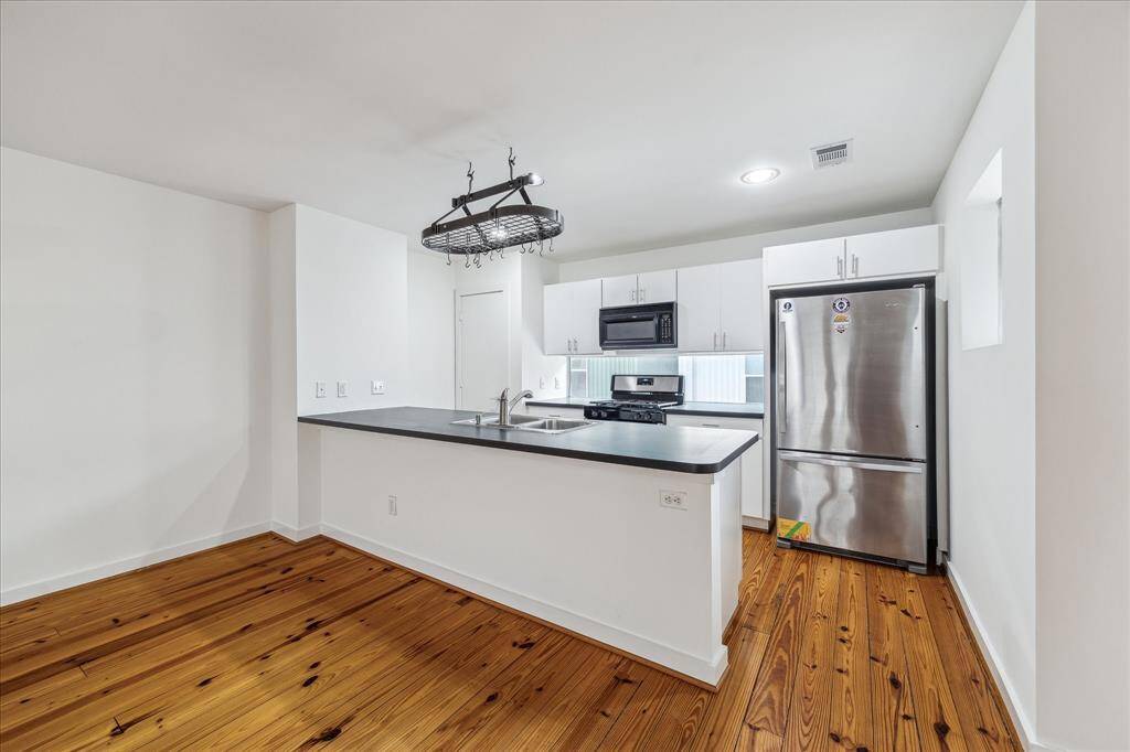 Full kitchen looks into the living/dining space for perfect entertaining.