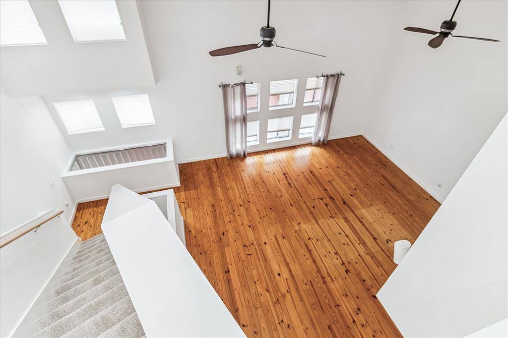 The 3rd floor with primary bedroom overlook your 2nd floor living/dining areas.