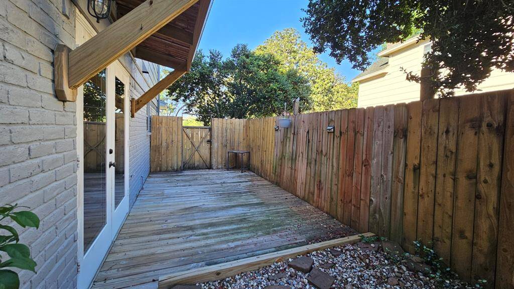 Comfortable back patio off the breakfast room. Lots of shade.