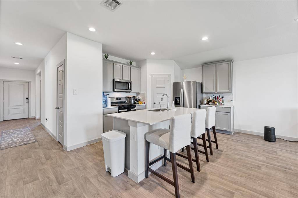 Stunning Kitchen with 42” Cabinets and Quartz Countertops.